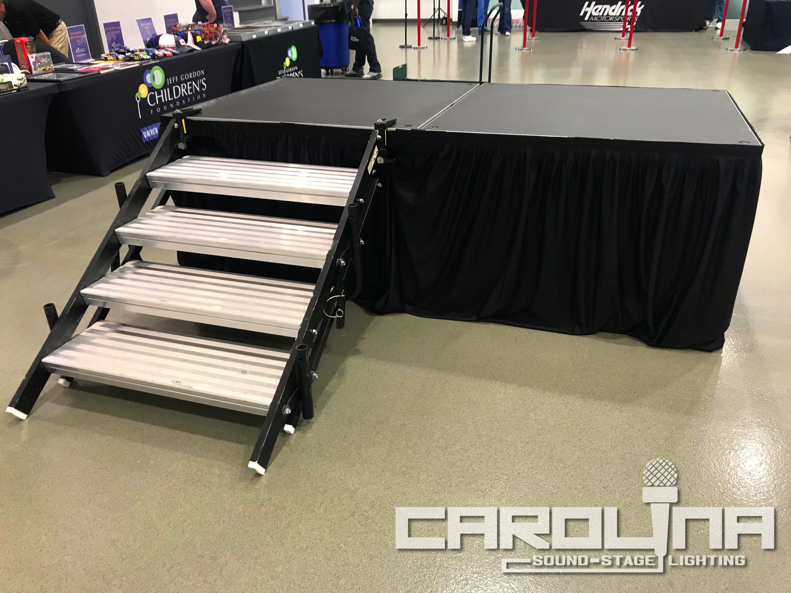 camera platform stage rental charotte nc 16x8 convention center carolina sound stage and lighting pro audio pa system pipe and drape av event production nc sc corporate
